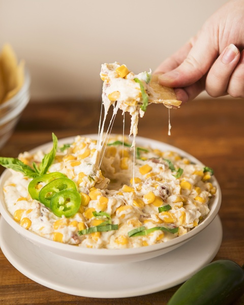 a cheese dip with corn