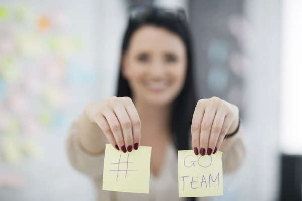 female employee with two post it