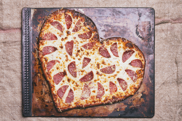 heart shaped pizza on pan