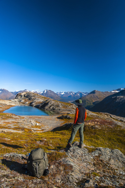 a man hiking near an unnamed
