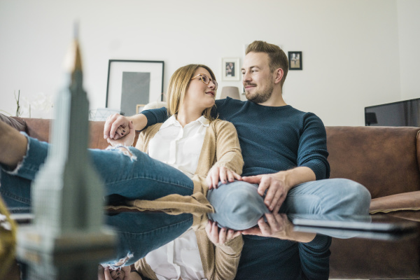 couple sitting on couch at home