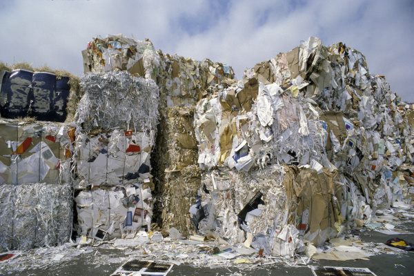 large mountain of stacked waste paper