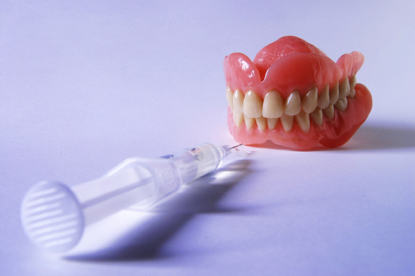 denture with injections artificial