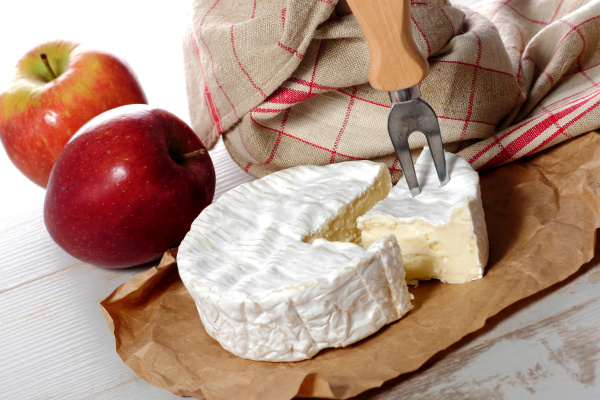 camembert of normandie with red apple