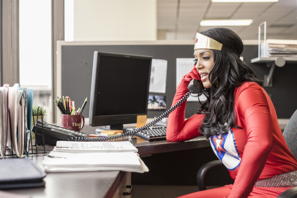 a black office superhero businesswoman takes