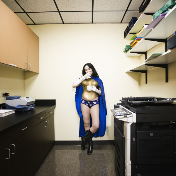a caucasian woman office super hero