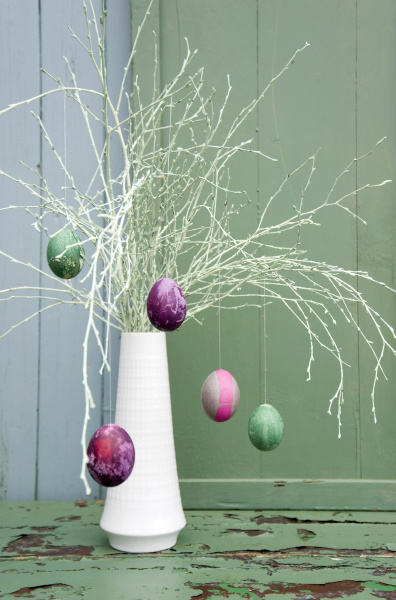 sprayed twigs with dyed easter eggs