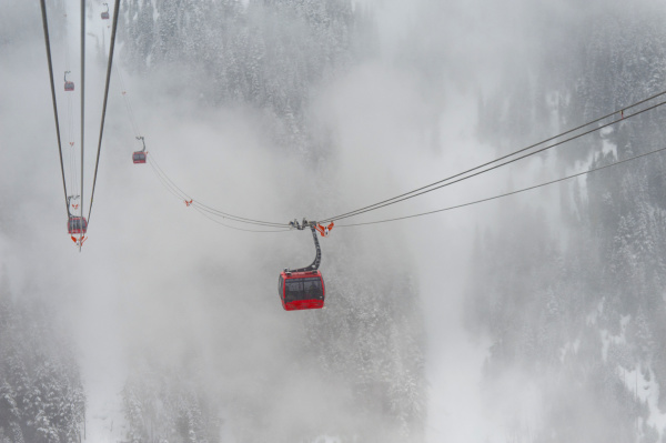 a red cable car above the