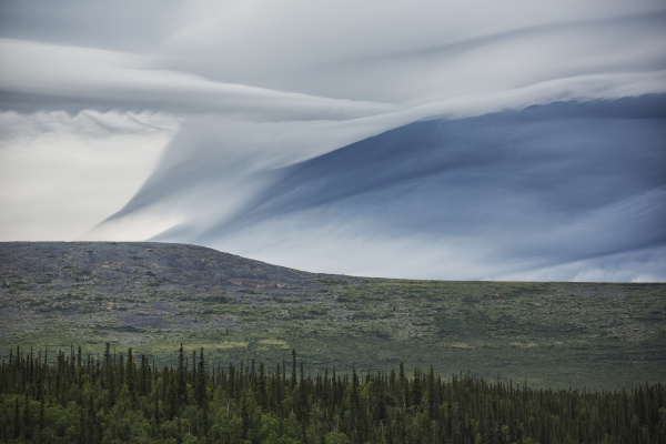 lenticular clouds form over the flanks