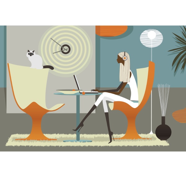woman listening to headphones on laptop