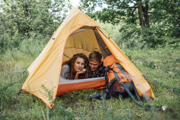 young couple camping in nature