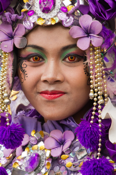 indonesian woman in carnival costume celebrating