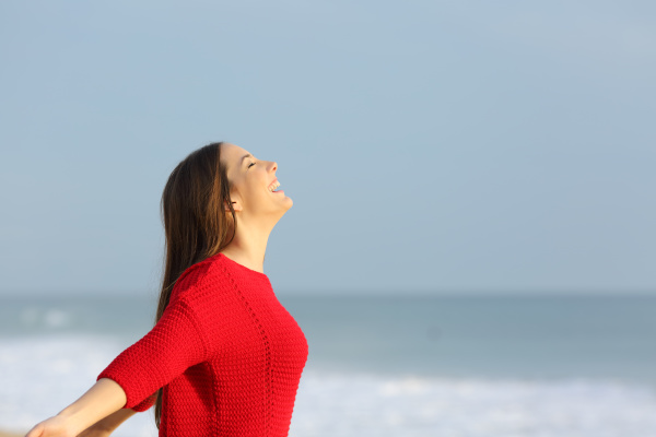 Woman in red breathing fresh air - Stock image #26607610 | PantherMedia ...