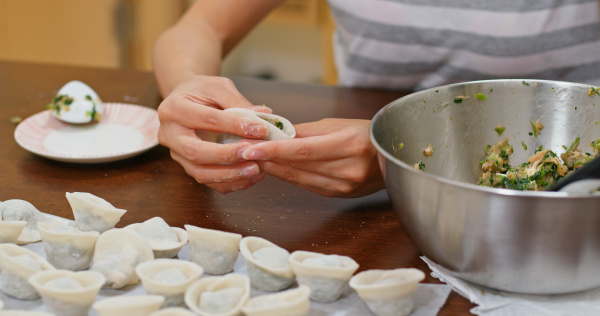 woman make with chinese meat dumpling