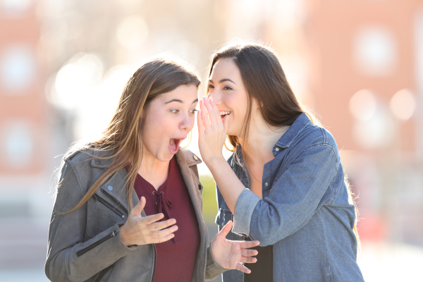 gossip woman telling secret to her
