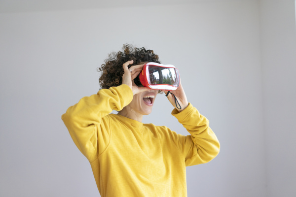 excited woman wearing vr glasses