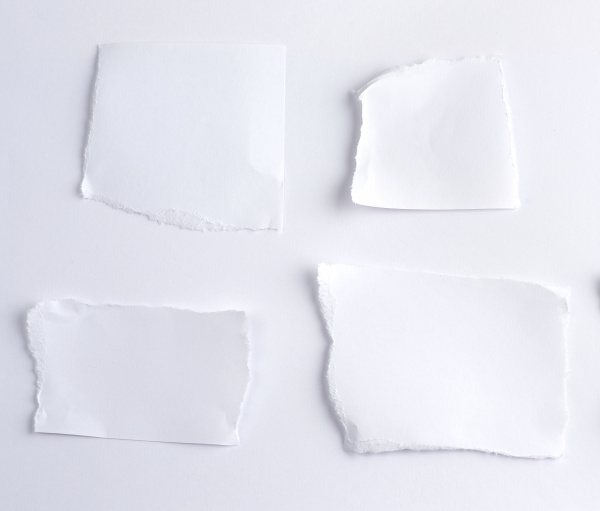 empty torn pieces of white paper