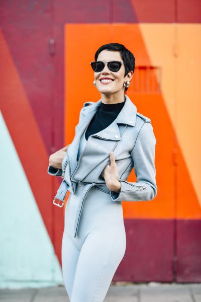 smiling fashionable young woman with colorful