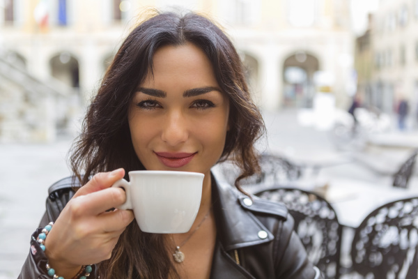 young woman with cup of coffee