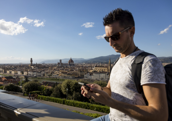 man using his smartphone florence