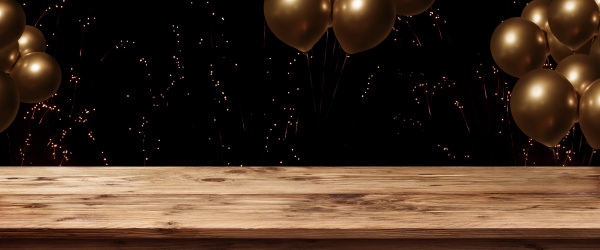 table with fireworks and golden ballons