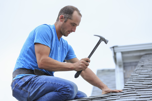 roofer with hearing aid on his