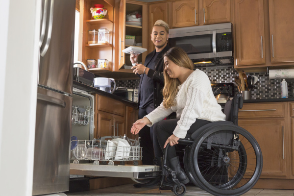 woman with spinal cord injury arranging