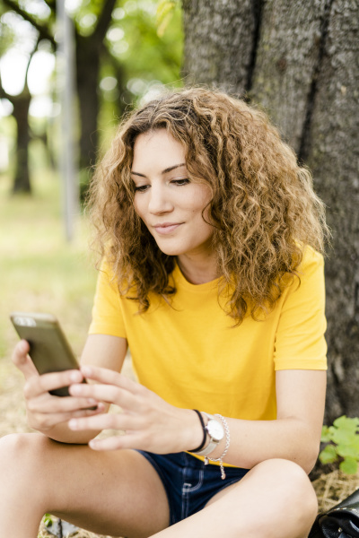 young woman using cell phone in