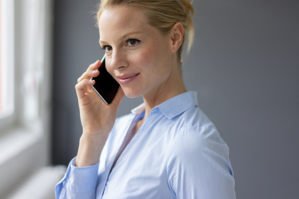 young businesswoman talking on cell phone