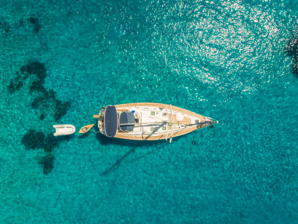 aerial view of sailboat anchored in