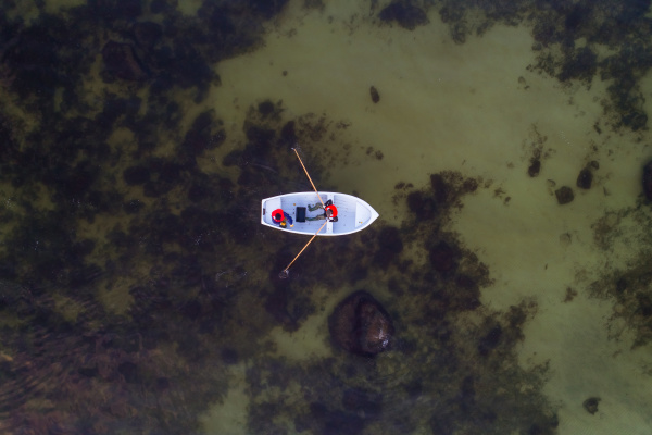 aerial view of two fishermen paddling