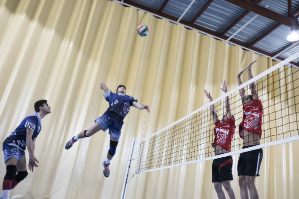 man jumping during a volleyball match