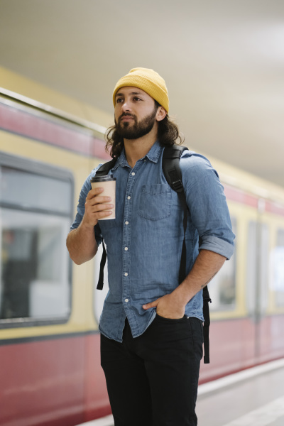 portrait of man with backpack and