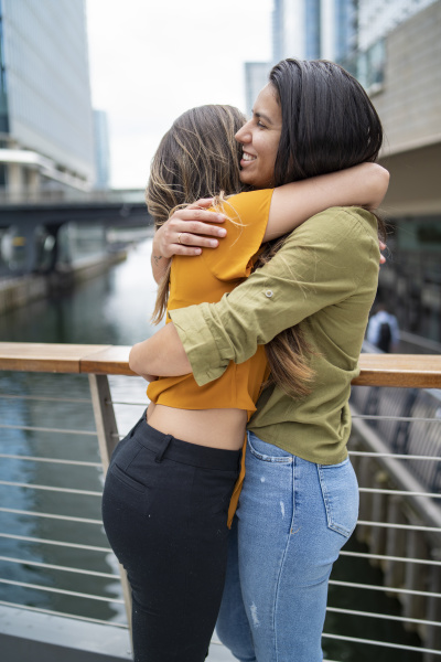 happy lesbian couple hugging in the