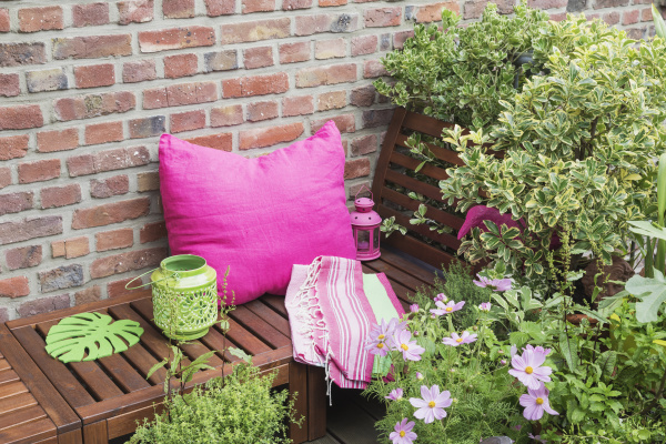 balcony with bench pink cushion
