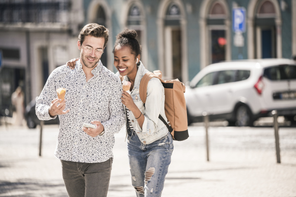 happy young couple with ice cream