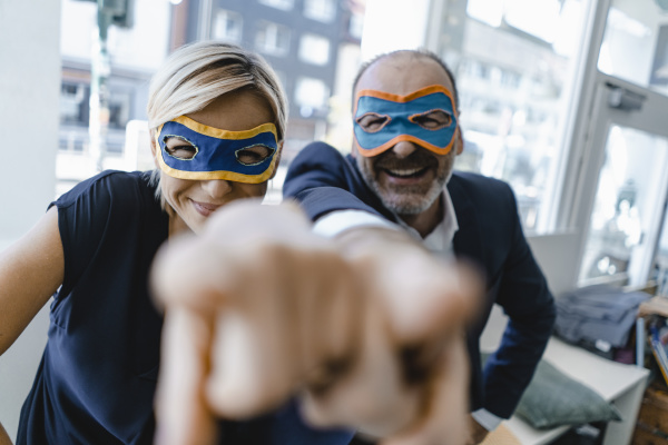 businessman and woman wearing super