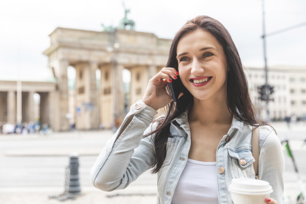 happy young woman on the phone