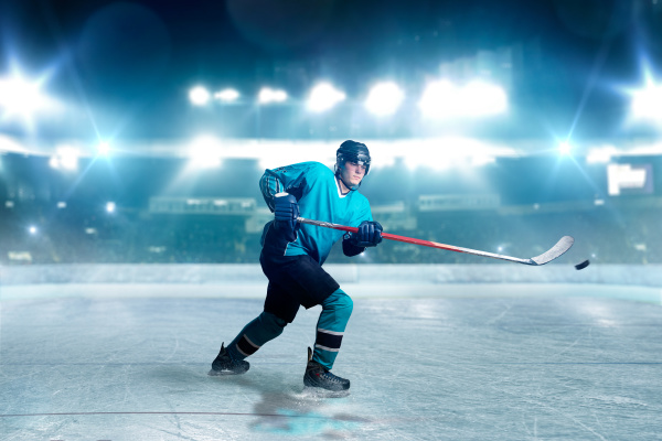 hockey player with stick and puck