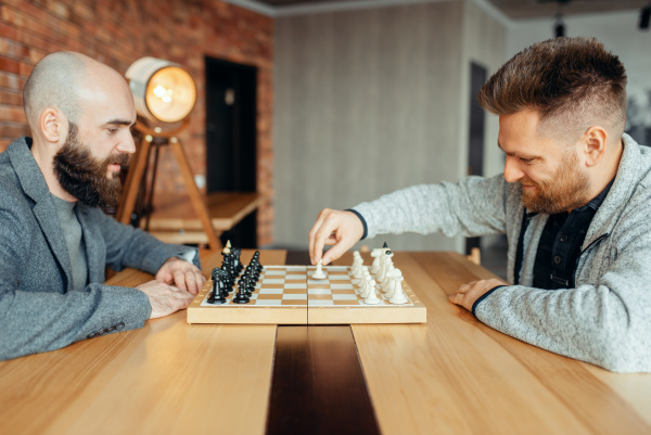 male chess players begin playing