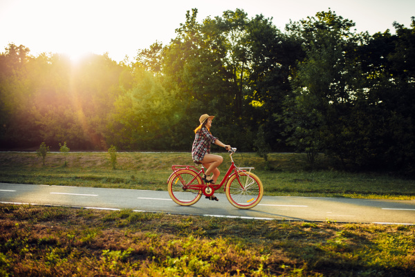 woman riding on vintage bicycle in
