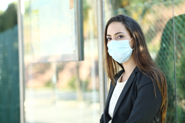 woman wearing a mask to prevent