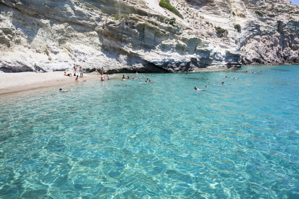 tourists swimming in the clear