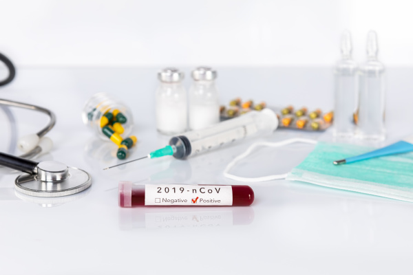 blood test tube with the coronavirus