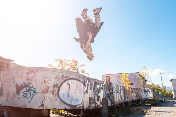 acrobat man doing somersault mid air