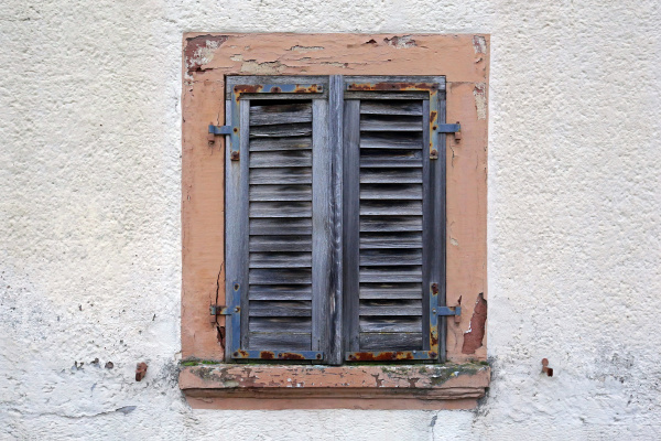 old window with the shutter closed
