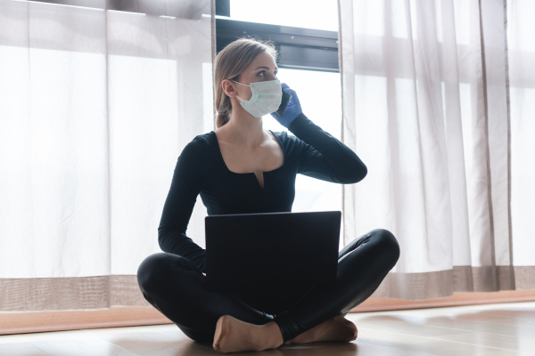 woman in corona quarantine with phone
