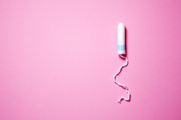 medical female tampon on a pink