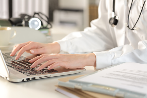 doctor, woman, hands, typing, on, laptop - 28277867