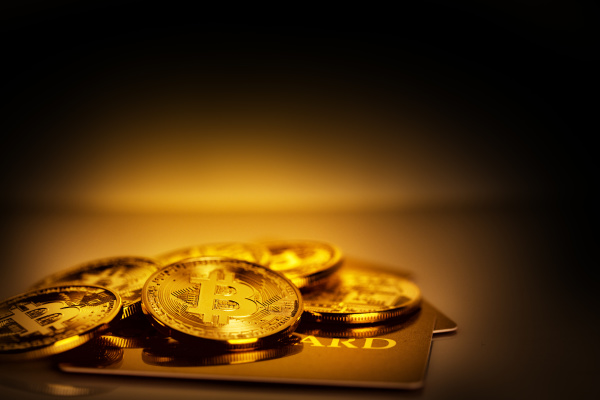 pile of gold bitcoins and gold